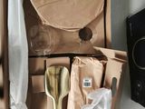 a cardboard box with a set of utensils and a plate in it