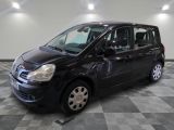 a picture of a small black car parked in a garage