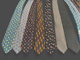 a lot of ties that are arranged together on a table