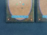 two cards with different designs on them on a table