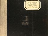 an old black and white photo of a book with a logo on it