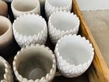 a wooden box filled with many different types of vases