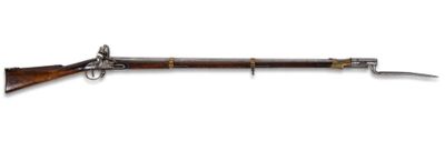 un vieux pistolet avec une crosse en bois et une crosse en métal
