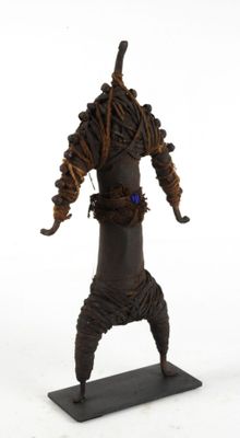 statue of a man with dreadlocks on his head holding a baseball bat