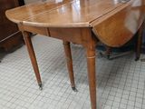 a wooden table with a wooden top on a tile floor
