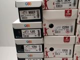 several boxes of different types of printer ink are stacked on top of each other