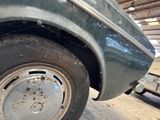 a close up of a car tire with rust on it