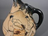 a vase with a picture of a man and a woman on it