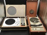 two turntables and a record player sitting on a table