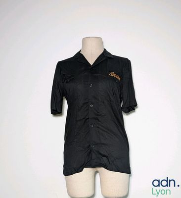 a female mannequin with a black shirt on it