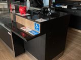 an image of a kitchen with a counter and a refrigerator
