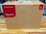 a box that has a blender in it on a table