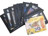 plusieurs livres sont empilés sur une surface blanche
