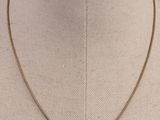 a close up of a necklace on a mannequin mannequin mannequin mannequin mannequin mannequin mannequin mannequin