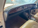 a dashboard of a car with leather seats and dashboard controls