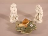 three figurines that are sitting on a table