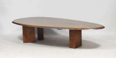 an oval wooden coffee table with two legs and a wooden base