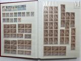 an open book with stamps on it on a table