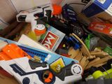 a box filled with assorted toys and other items