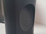 a black speaker that is sitting on a table
