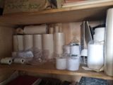 many rolls of toilet paper sitting on a shelf