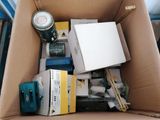 a box full of assorted items and tools in it