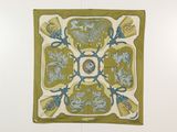 une photo représentant un motif floral vert et bleu sur un mur