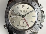 a close up of a watch on a white surface