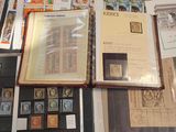 many different types of stamps on display on a table