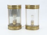pair of brass and glass table lamps with a clear glass shade