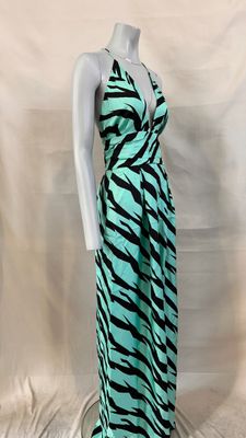 a green and black zebra print dress on a mannequin mannequin mannequin mannequin mannequin mannequin mannequin manne