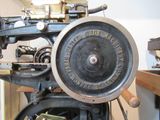 a close up of an old type of sewing machine