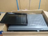 two pans and a tray in a box