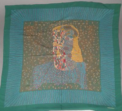 a green scarf with a picture of a woman on it