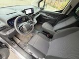 the interior of a car with a steering wheel and dashboard controls