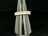 a silver ring that is on top of a cone