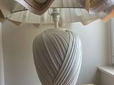 a lamp that is sitting on a table near a window