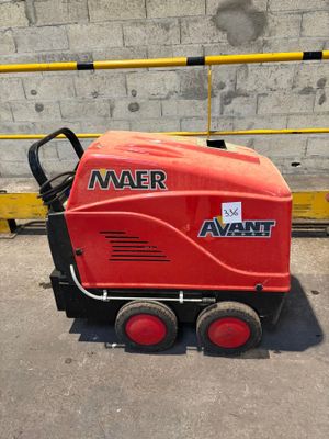 a red machine that is sitting on the ground