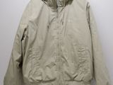 an image of a jacket hanging on a hanger on a wall