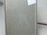 a mirror that is sitting on a table next to a vase