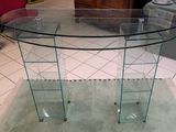 a glass table with a glass top on a rug