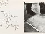 a black and white photo of a person standing on a piece of paper