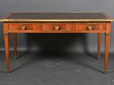 an antique writing desk with two drawers and a leather top