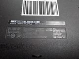 the back of a laptop with a barcode on it