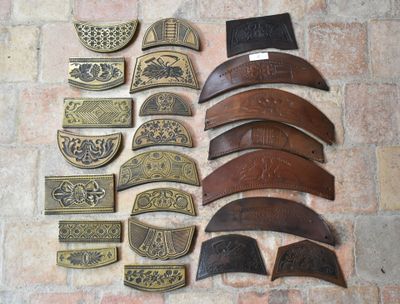 a lot of different pieces of leather on the floor