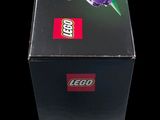 a box that has a lego flower on it