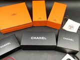 three boxes of chanel bracelets are sitting on a table