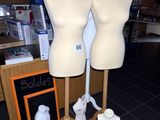 three mannequins on display in a store