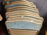 a lot of chairs that are stacked on top of each other