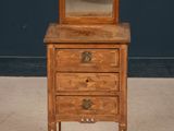 an old wooden dresser with a mirror on top of it